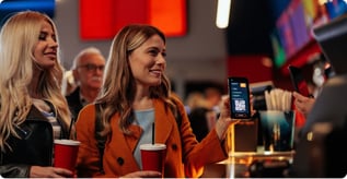 Woman paying with phone